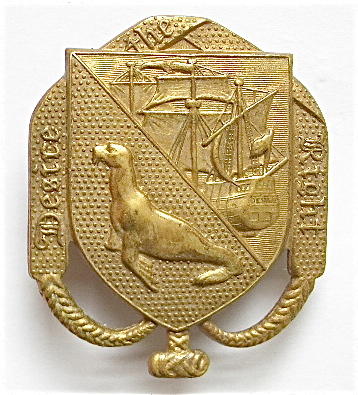 Falkland Islands Volunteer Corps die-stamped brass cap badge.