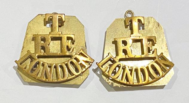 T / RE / LONDON pair of brass shoulder titles circa 1908-20.