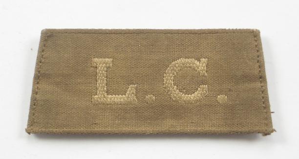 WW1 Labour Corps Slip on Cloth Shoulder Title.