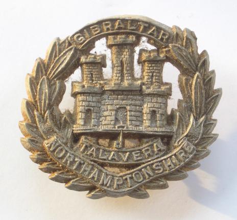 WW2 Northamptonshire Regiment Economy Issue Plastic Cap Badge.