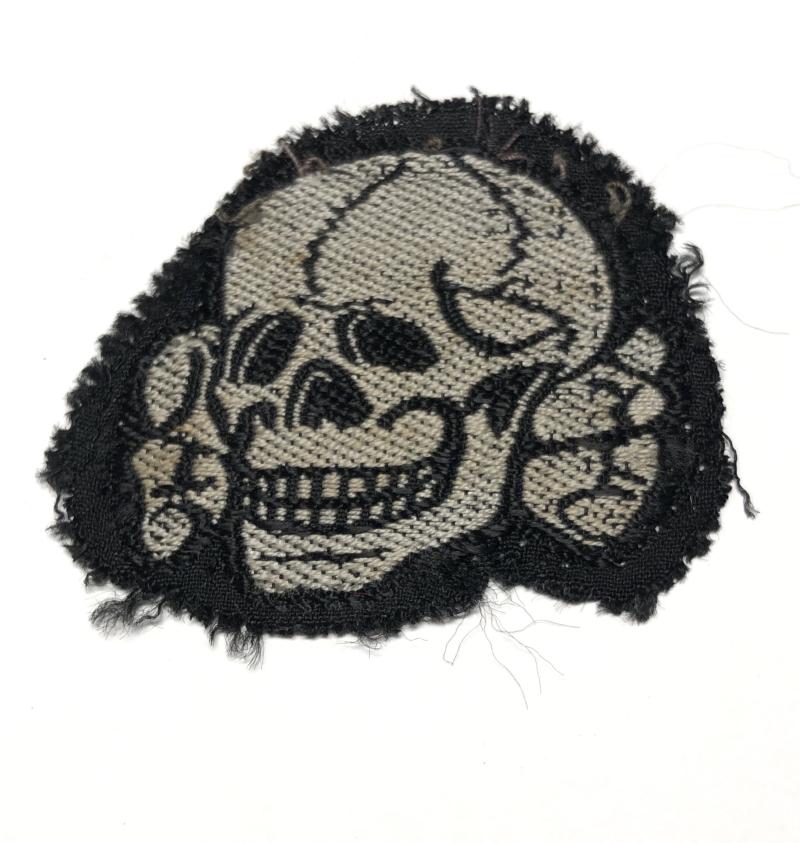 German Third Reich SS cloth skull and crossed bones cap badge.