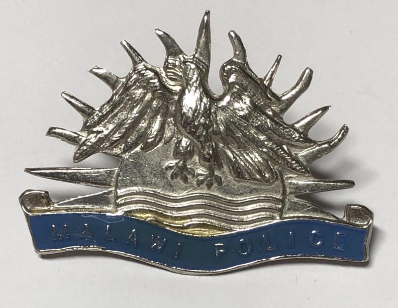 Malawi Police cap badge.