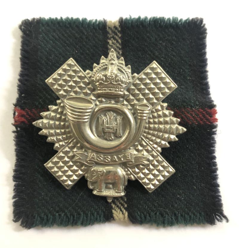 Highland Light Infantry HLI post 1902 glengarry badge on Tartan backing..